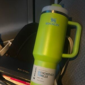 - Neon green and blue 40oz Stanley Quencher H2O tumbler with straw lid